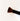 a black makeup brush with brown bristles that come to a flat, blunt shape on top. The bristles are medium to dense packed.