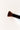 a black makeup brush with brown bristles that come to a flat, blunt shape on top. The bristles are medium to dense packed.